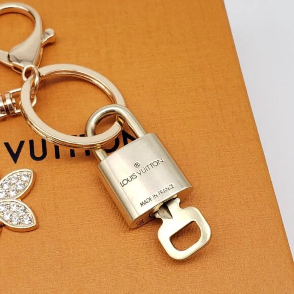 Authentic Louis Vuitton Gold Lock & Box w/ Unbranded Flower Bagcharm 120825